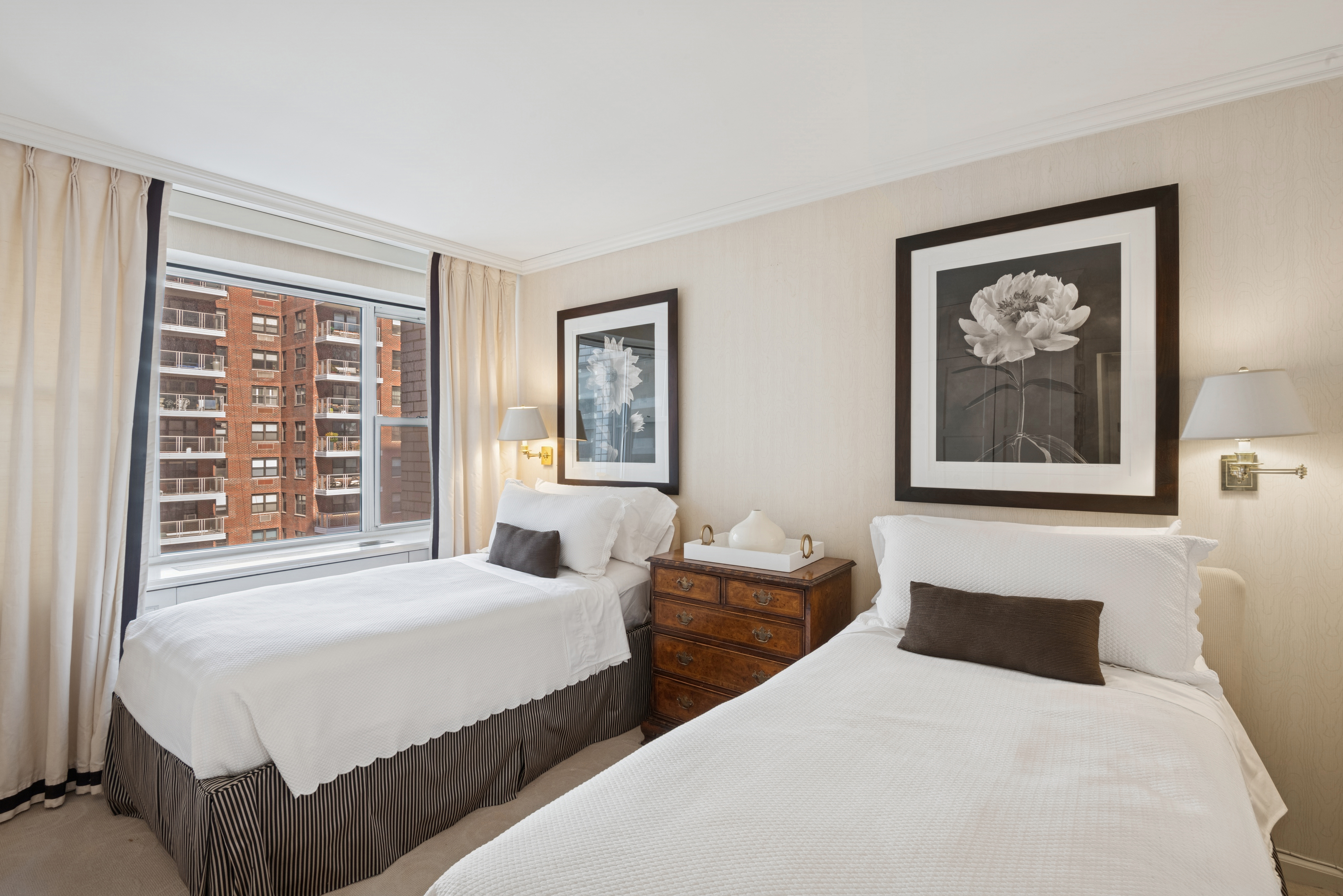 45 Sutton Place South, Unit 12I Manhattan, NY 10022 - Photo 7 of 14 a bedroom with double bed and a window