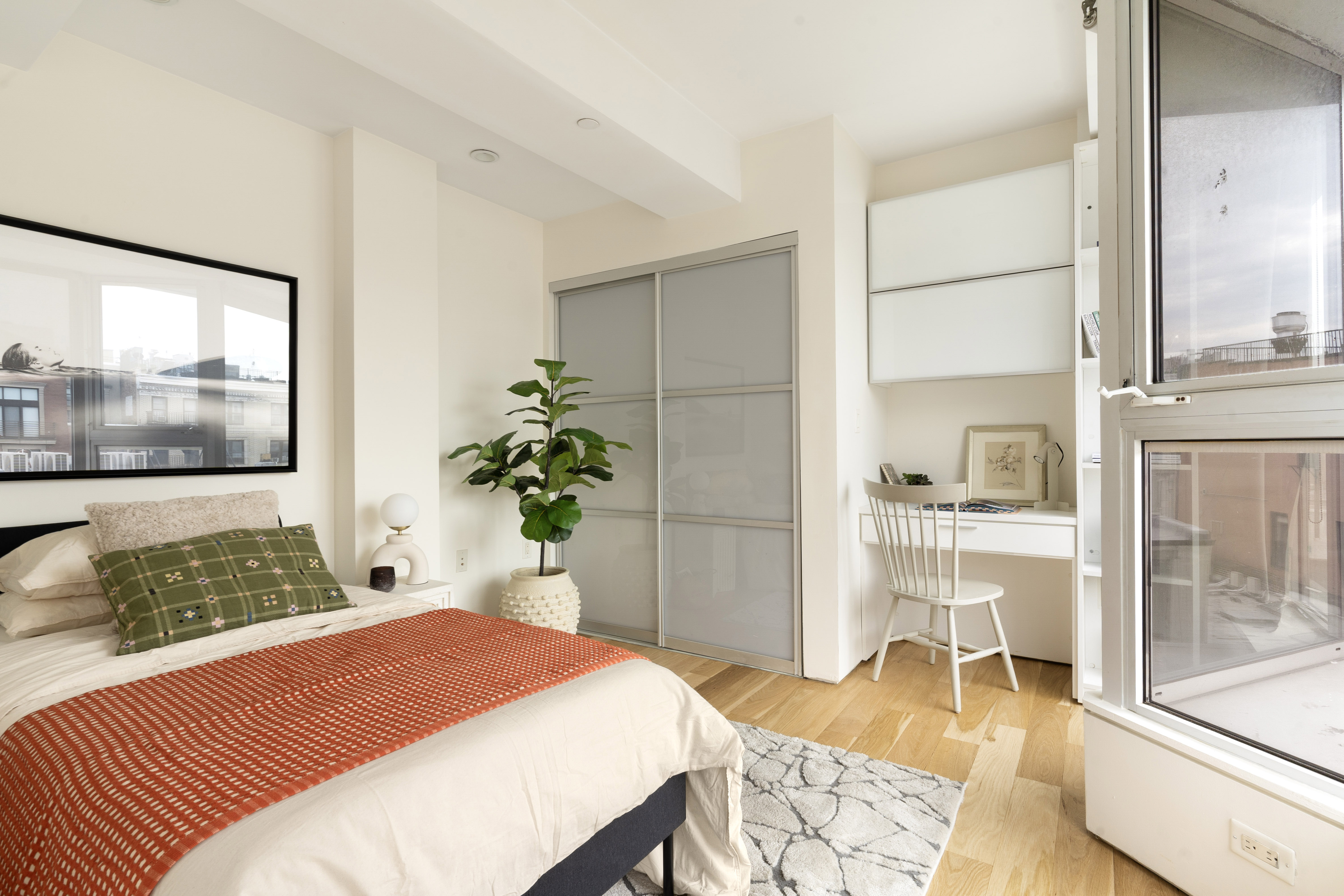 142 North 1st Street, Unit PH Brooklyn, NY 11249 - Photo 10 of 15 a bedroom with a bed and wooden floor