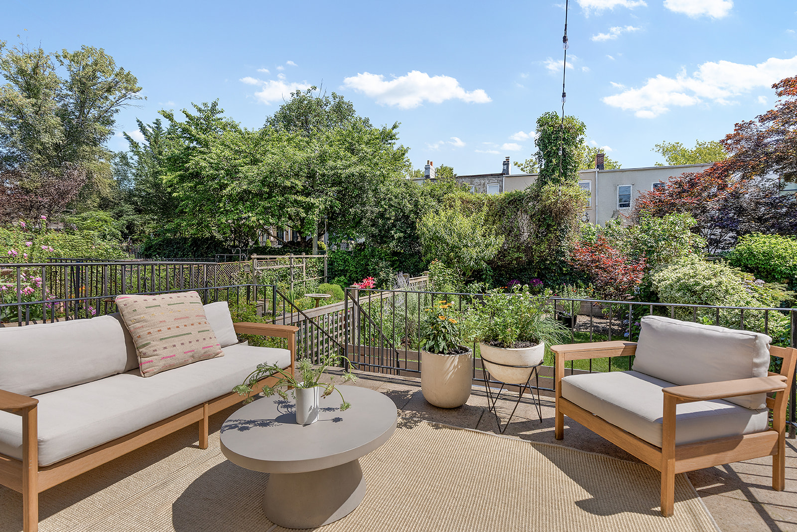 47 Sherman Street, Unit 2 Brooklyn, NY 11215 - Photo 4 of 23 a view of a patio with couches a table and chairs and potted plants