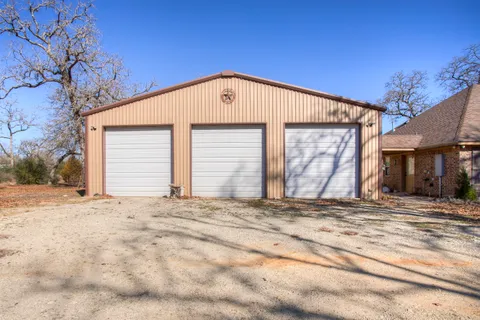 a view of a house with a snow in the yard