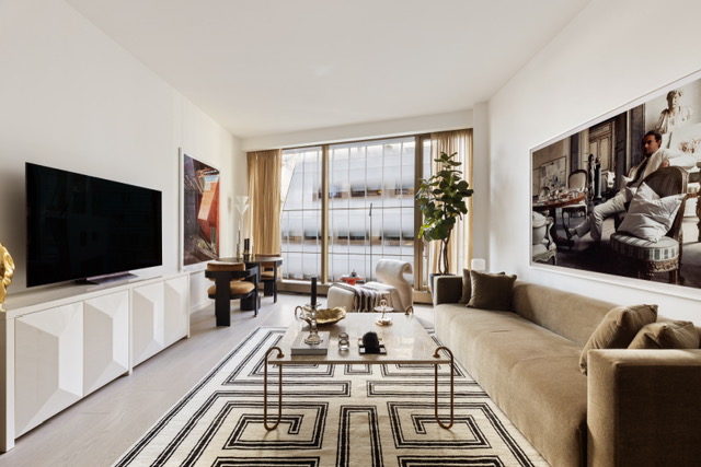 500 West 18th Street, Unit WEST 5E Manhattan, NY 10011 - Photo 6 of 15 a living room with furniture and a flat screen tv