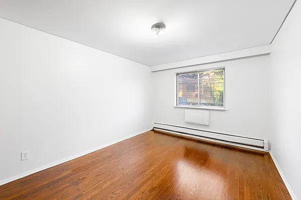 25-92 36th Street, Unit 2 Queens, NY 11103 - Photo 2 of 7 an empty room with a window