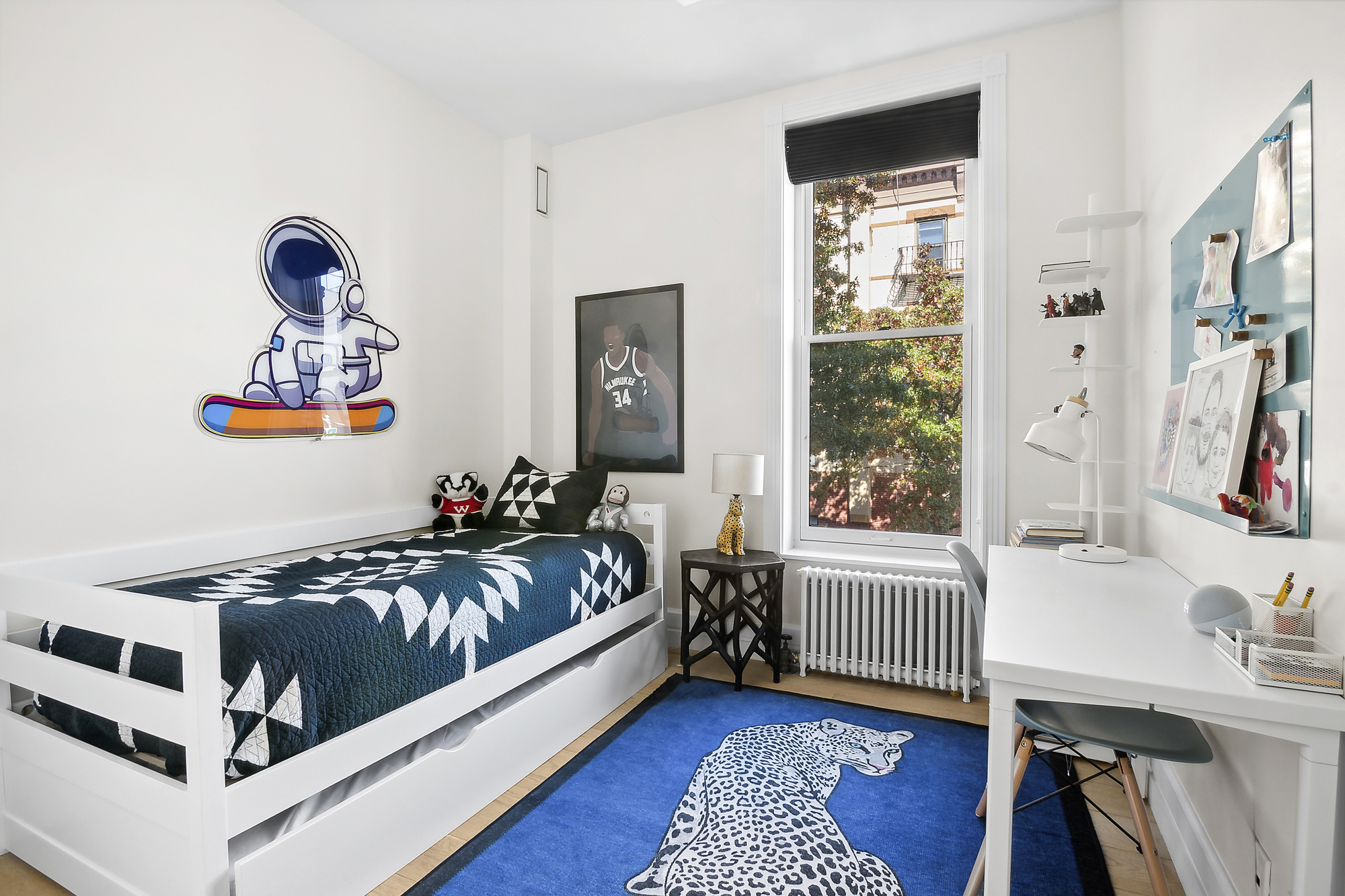 374 14th Street Brooklyn, NY 11215 - Photo 9 of 11 a bedroom with furniture and a window