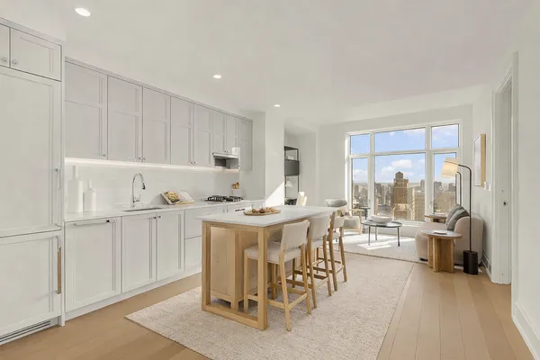 a kitchen with appliances a sink and cabinets