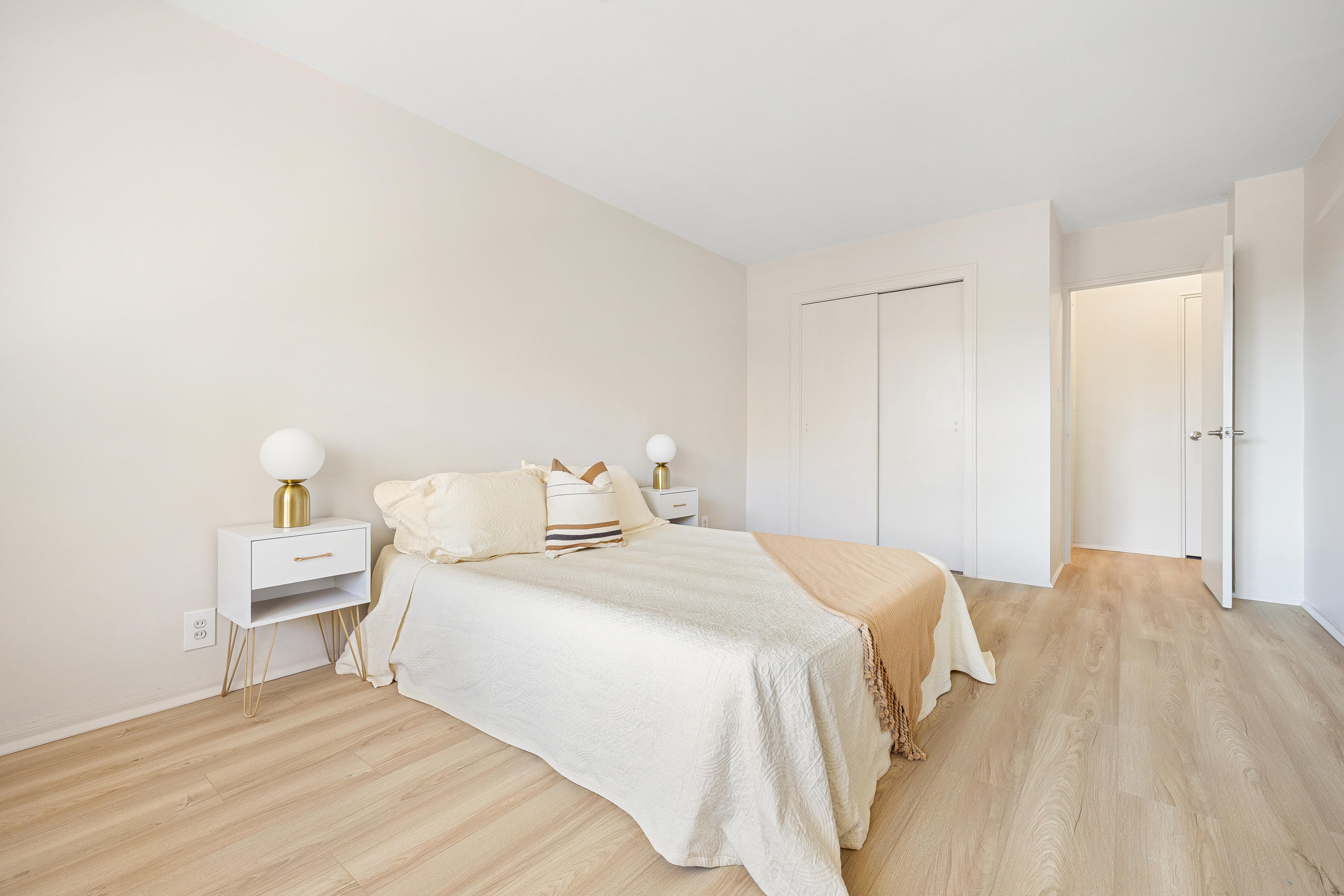 35-51 85th Street, Unit 4M Queens, NY 11372 - Photo 8 of 10 a bedroom with a bed and a lamp
