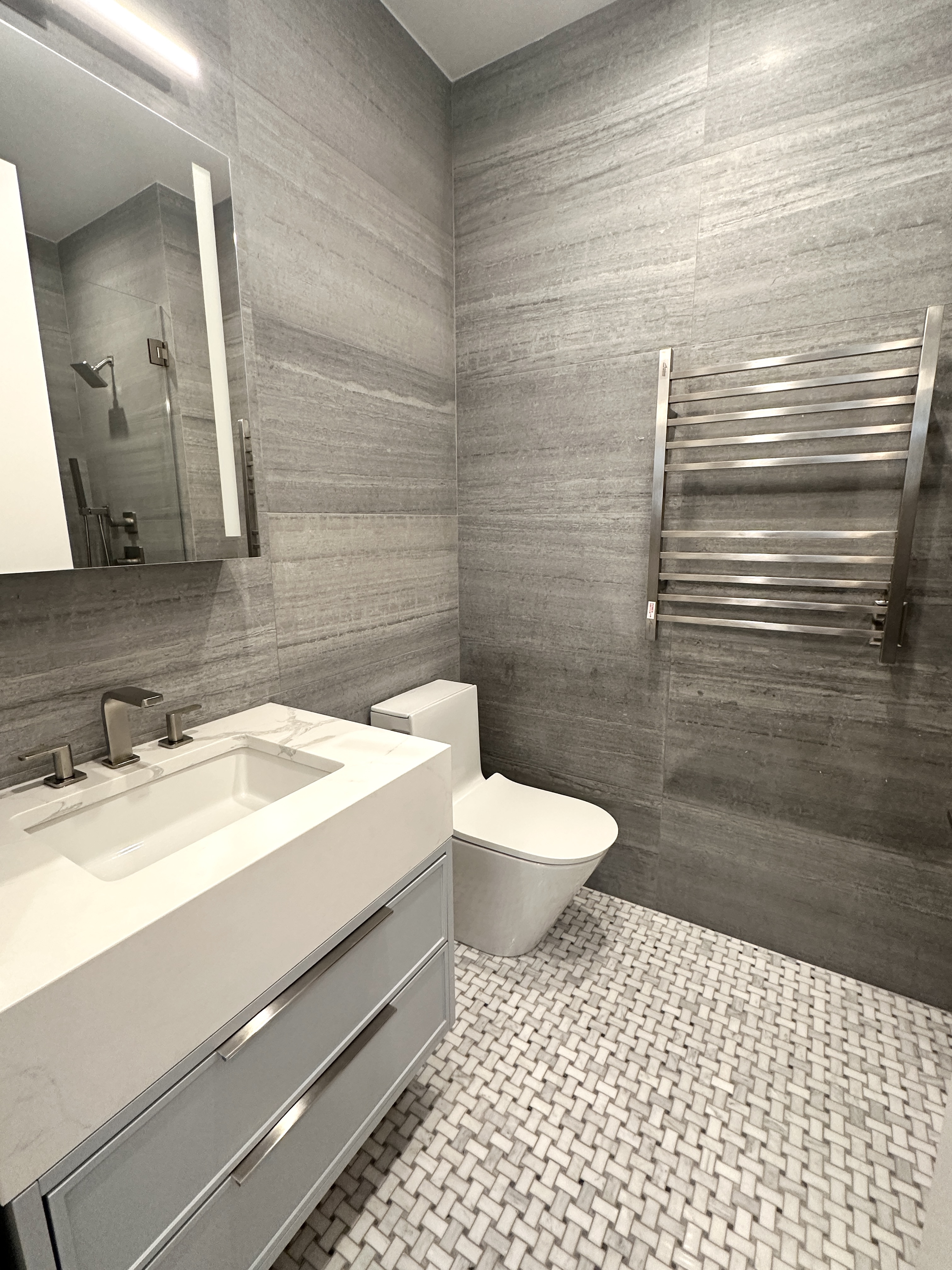 183 Java Street, Unit 1A Brooklyn, NY 11222 - Photo 6 of 12 a bathroom with a sink a toilet and a mirror