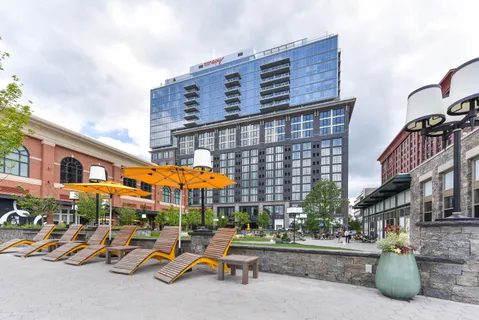 a table and chairs in front of a building