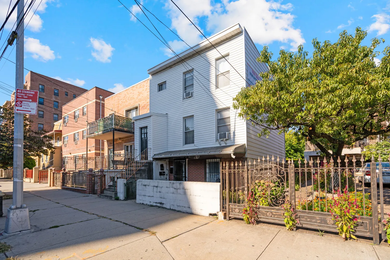 a view of a brick house with many windows