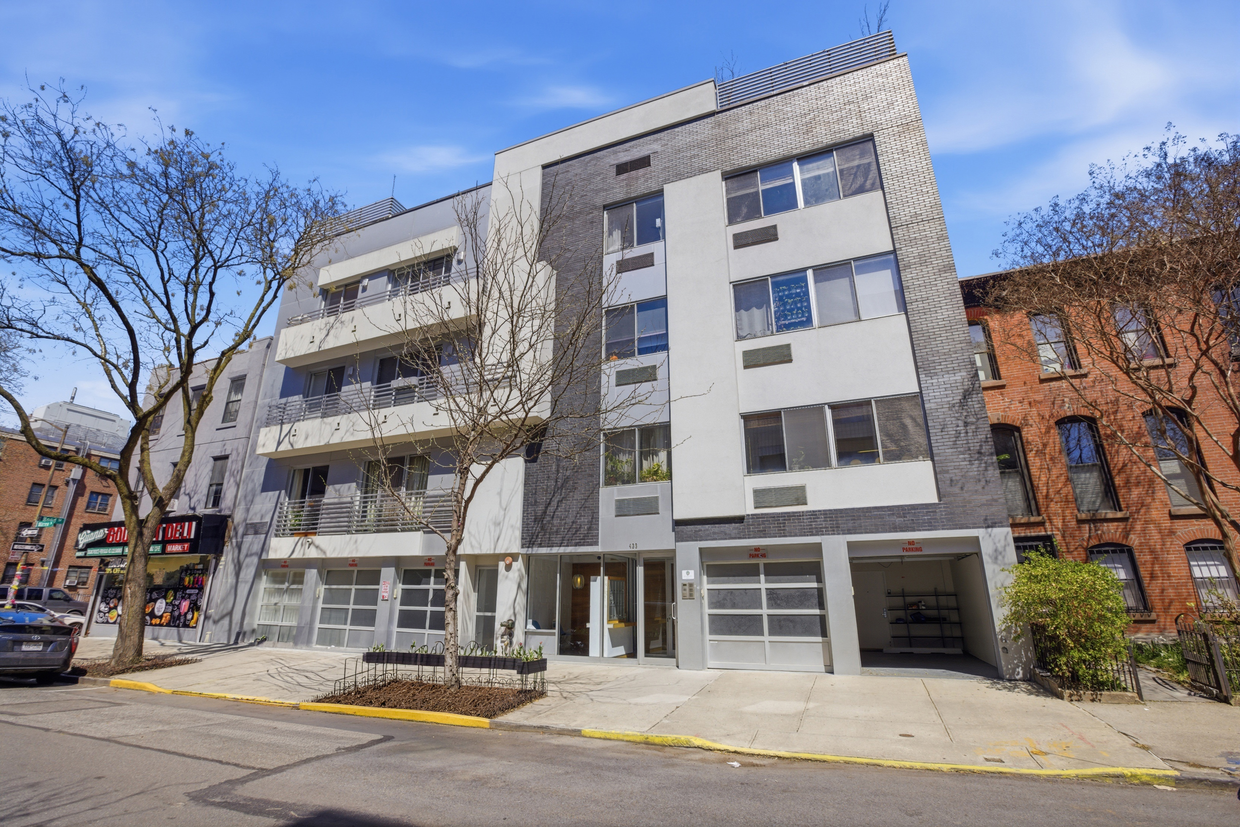 433 Warren Street, Unit 2C Brooklyn, NY 11217 - Photo 9 of 19 a front view of a building with street