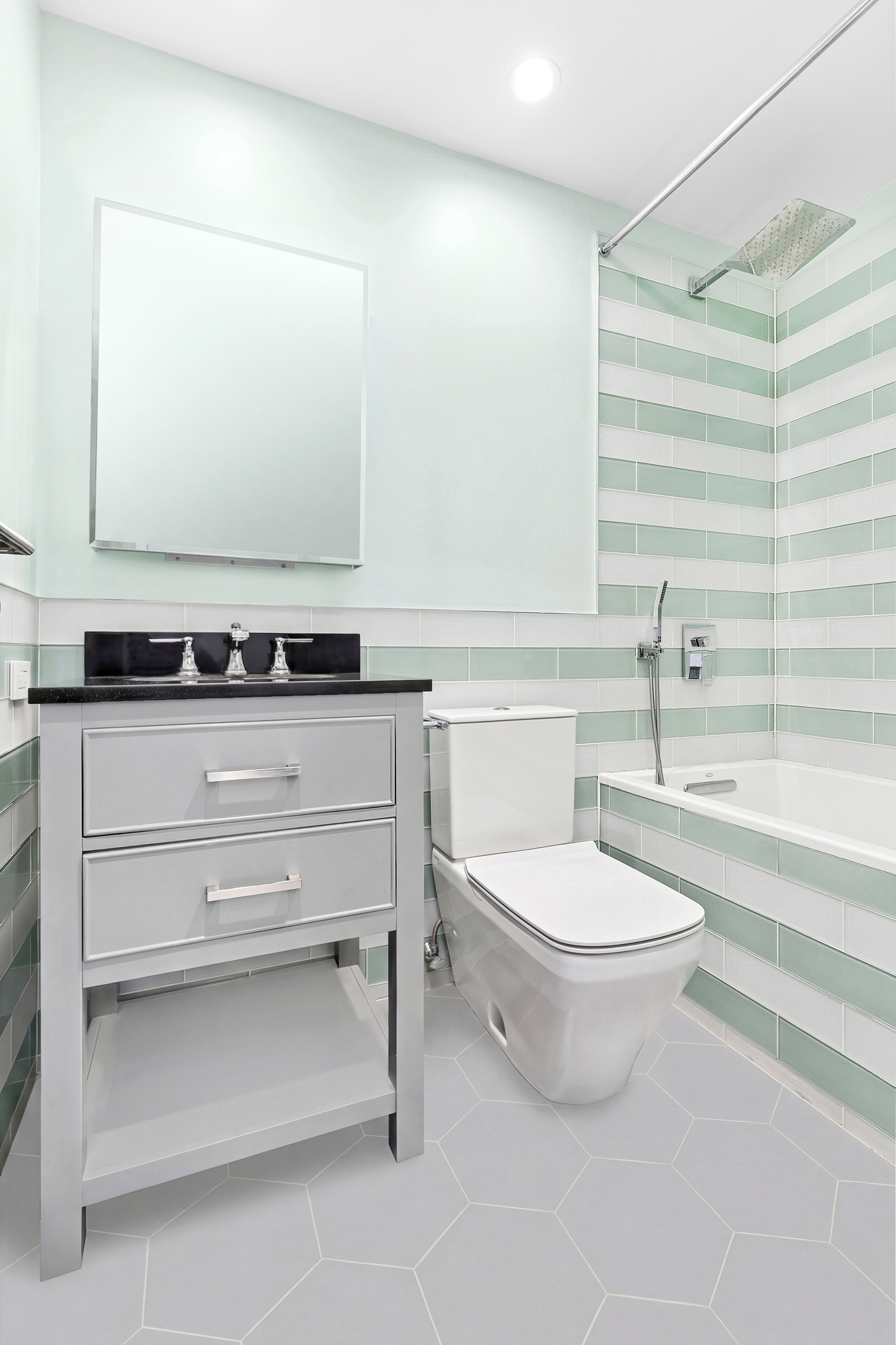 21 South End Avenue, Unit 402 Manhattan, NY 10280 - Photo 10 of 13 a bathroom with a sink toilet and mirror