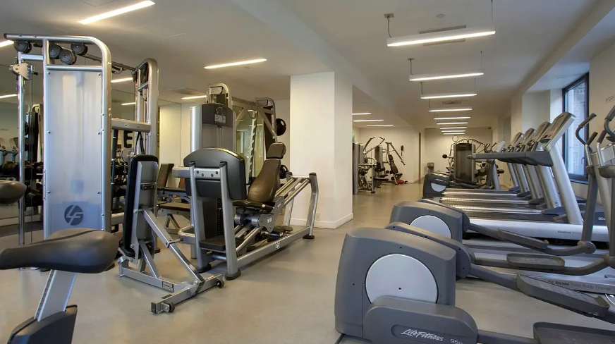 450 East 83rd Street, Unit 9E Manhattan, NY 10028 - Photo 15 of 18 a view of a room with gym equipment