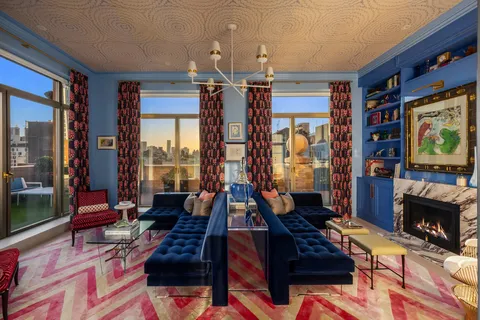 a living room with fireplace furniture and a flat screen tv