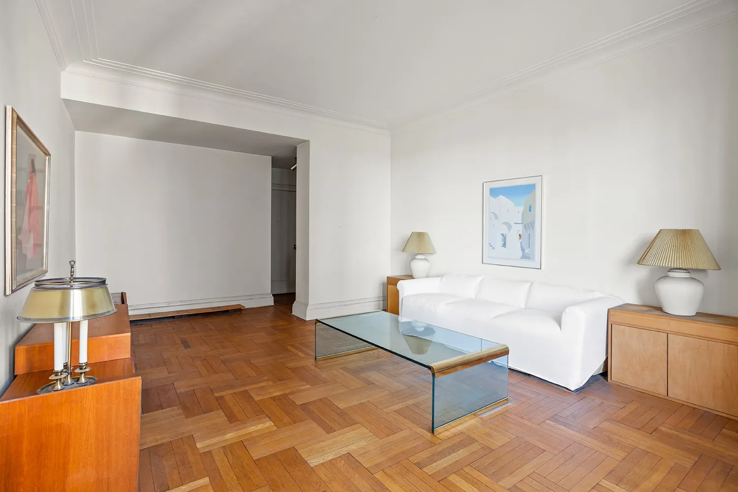 a living room with furniture a lamp and a window
