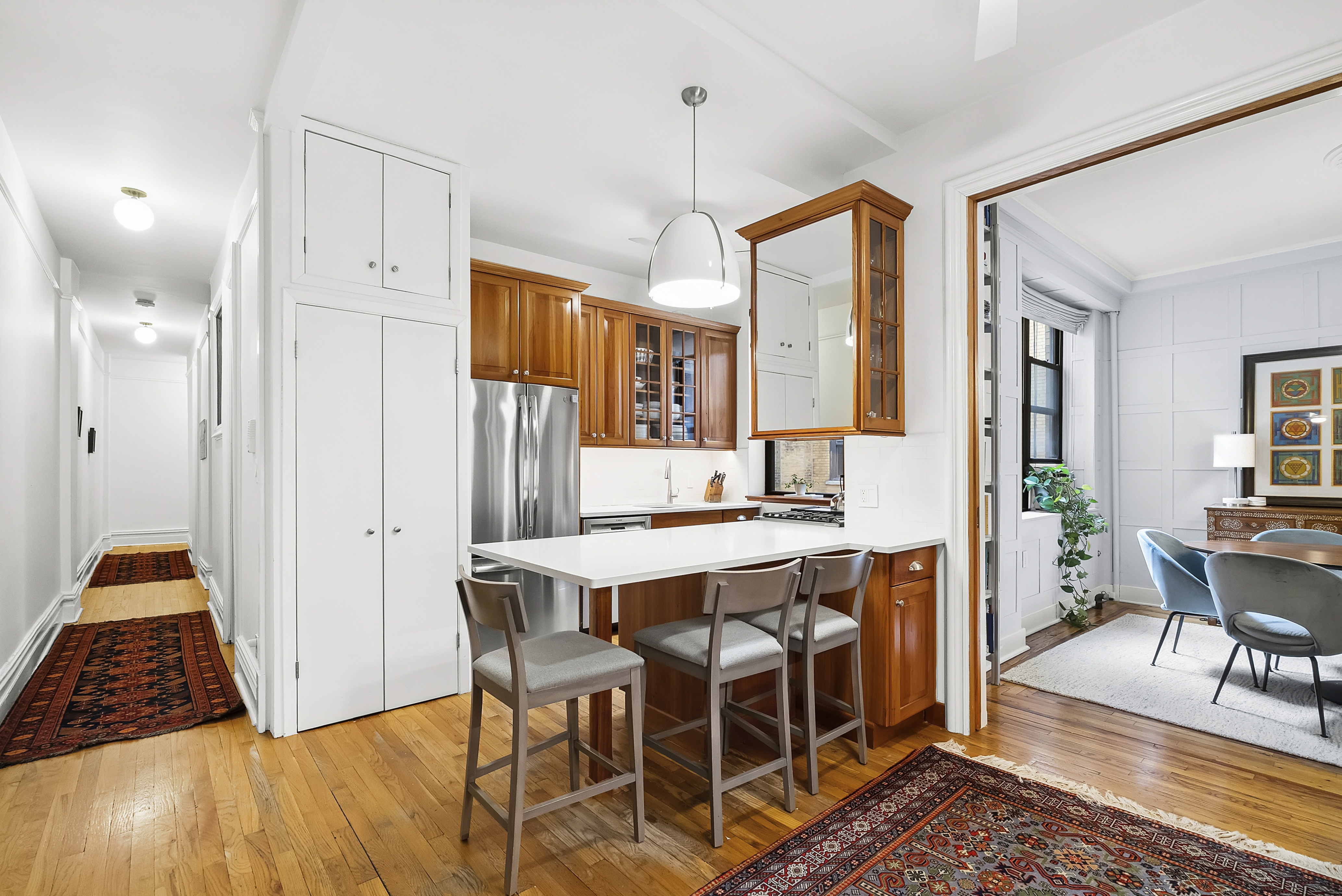 536 West 111th Street, Unit 66 Manhattan, NY 10025 - Photo 2 of 8 a view of a dining room with furniture window and wooden floor