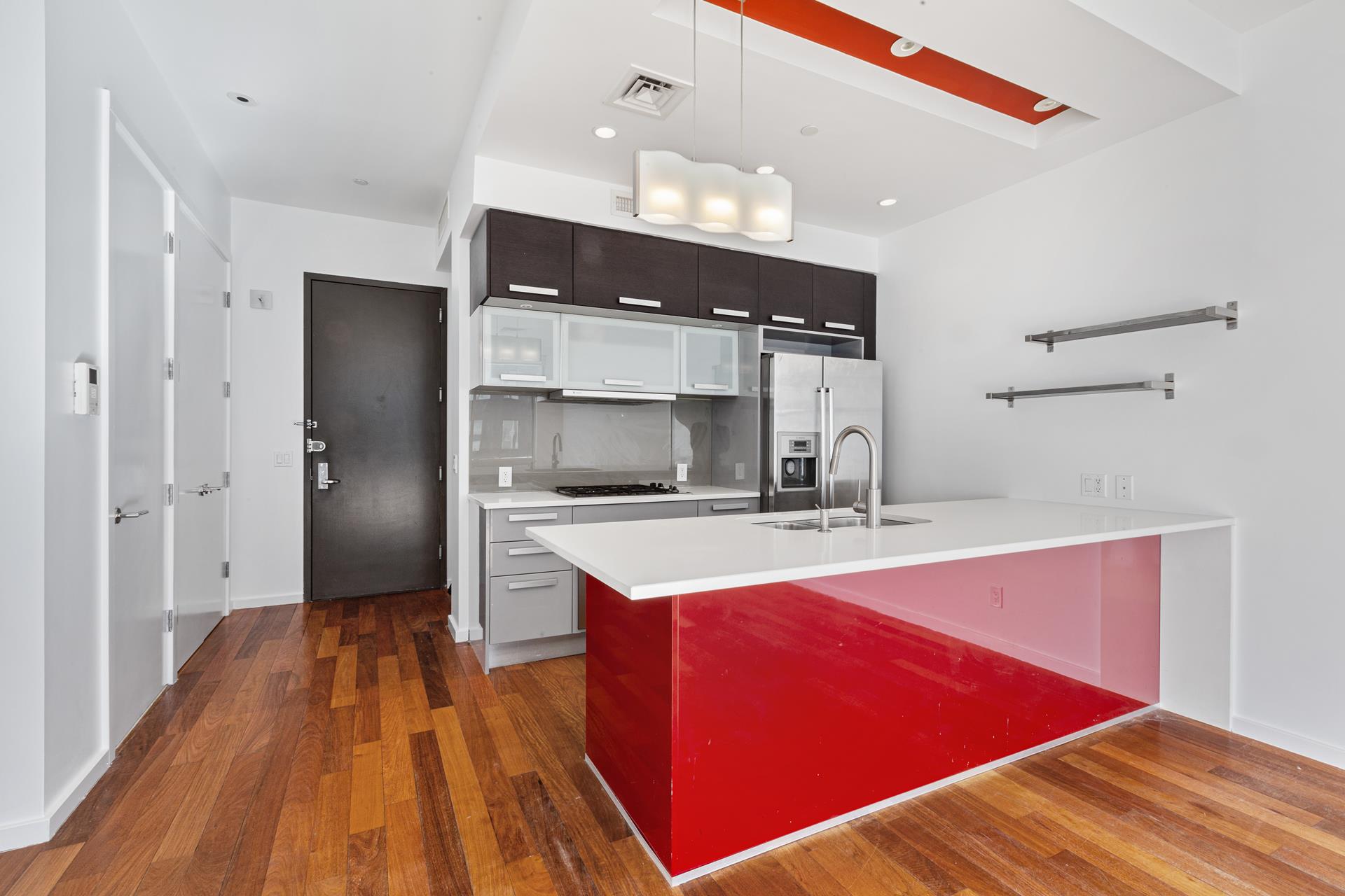 170 North 11th Street, Unit 3F Brooklyn, NY 11211 - Photo 6 of 9 a view of a kitchen with a sink and refrigerator