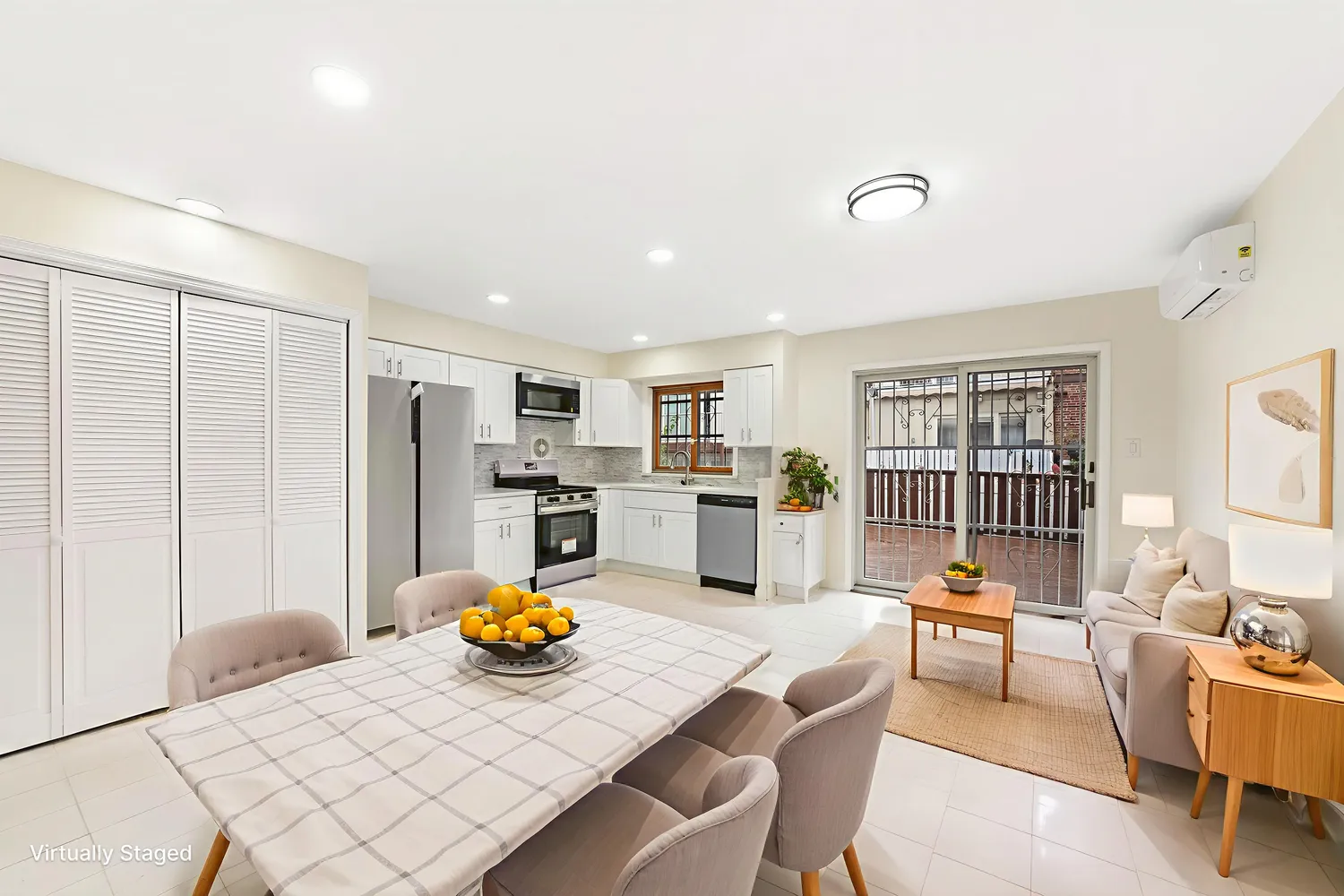 a view of kitchen with stainless steel appliances dining table and chairs