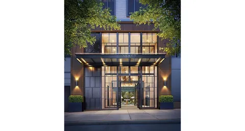 a view of entryway with a floor to ceiling window and potted plants