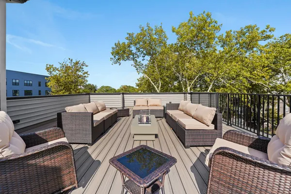 a view of a patio with couches and potted plants