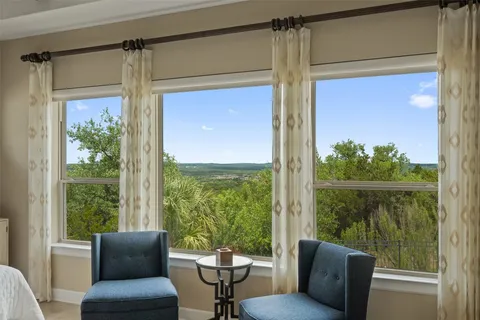 a balcony view with a couch and wooden floor