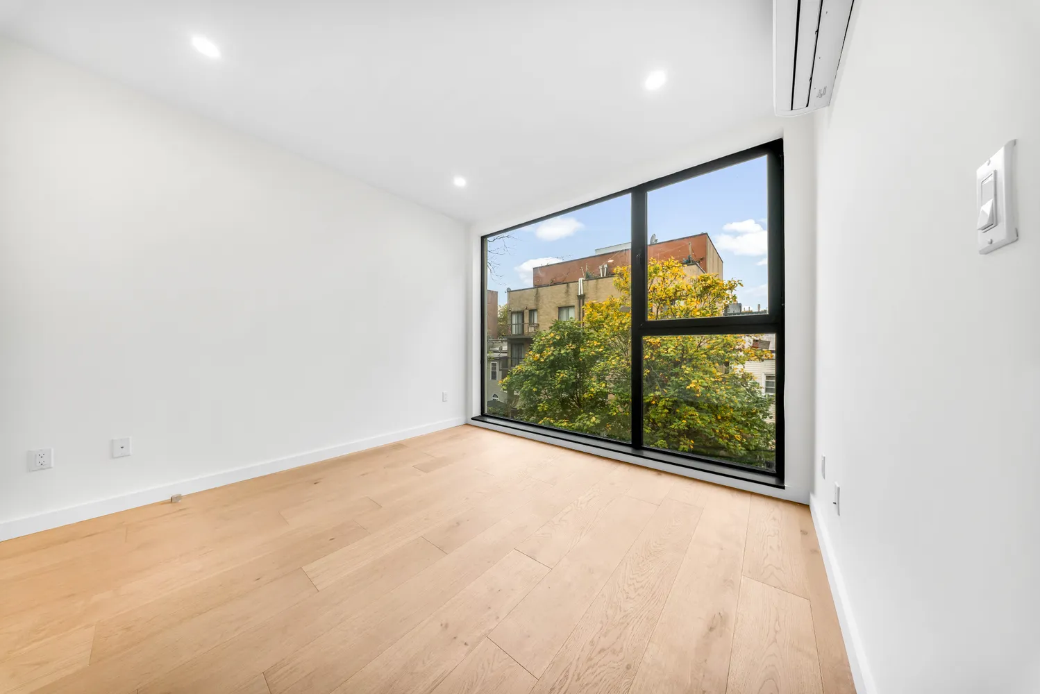 a view of an empty room with a window