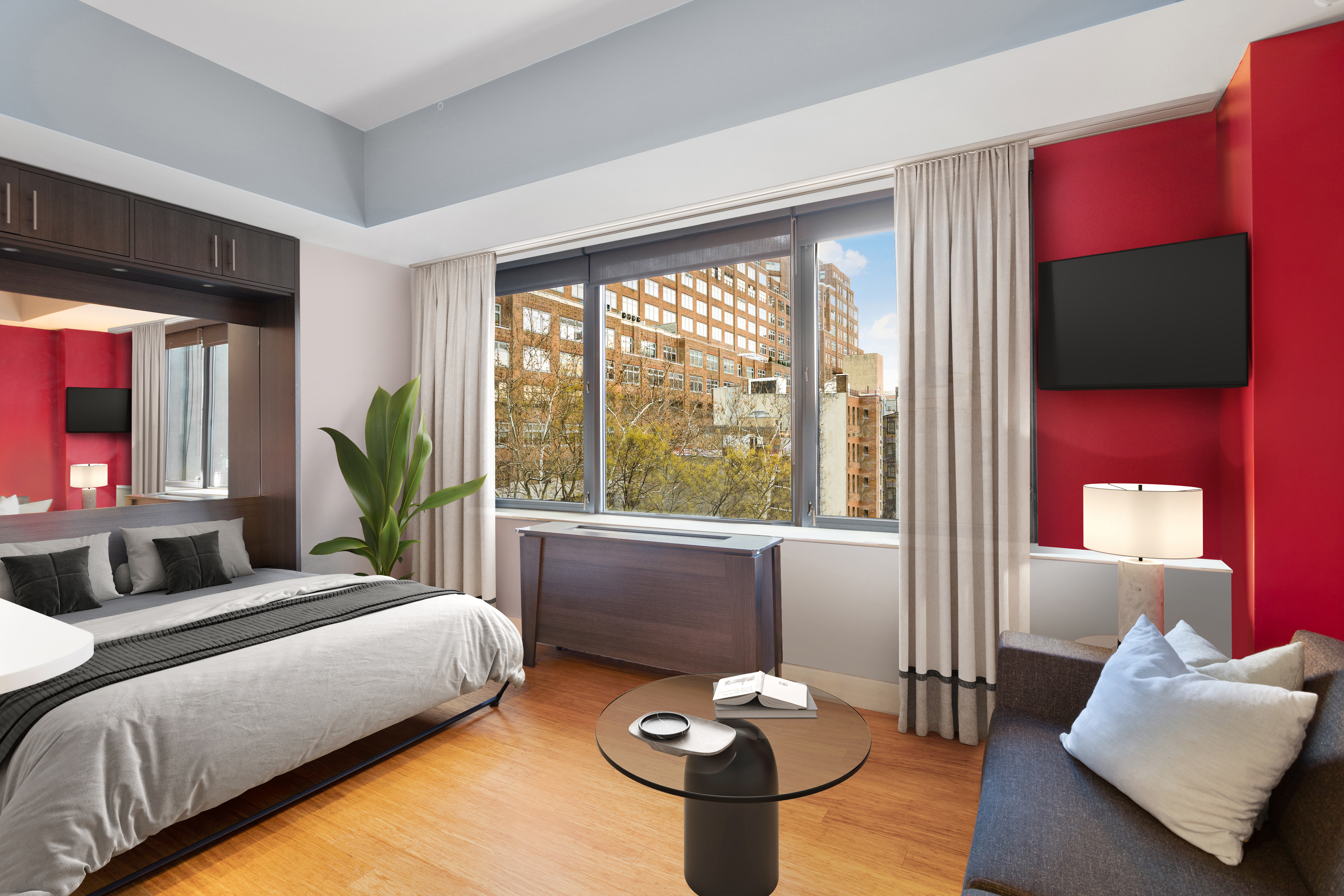 305 West 16th Street, Unit 5B Manhattan, NY 10011 - Photo 2 of 15 a bedroom with a bed and a flat screen tv