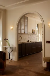 a living room with granite countertop furniture and a fireplace
