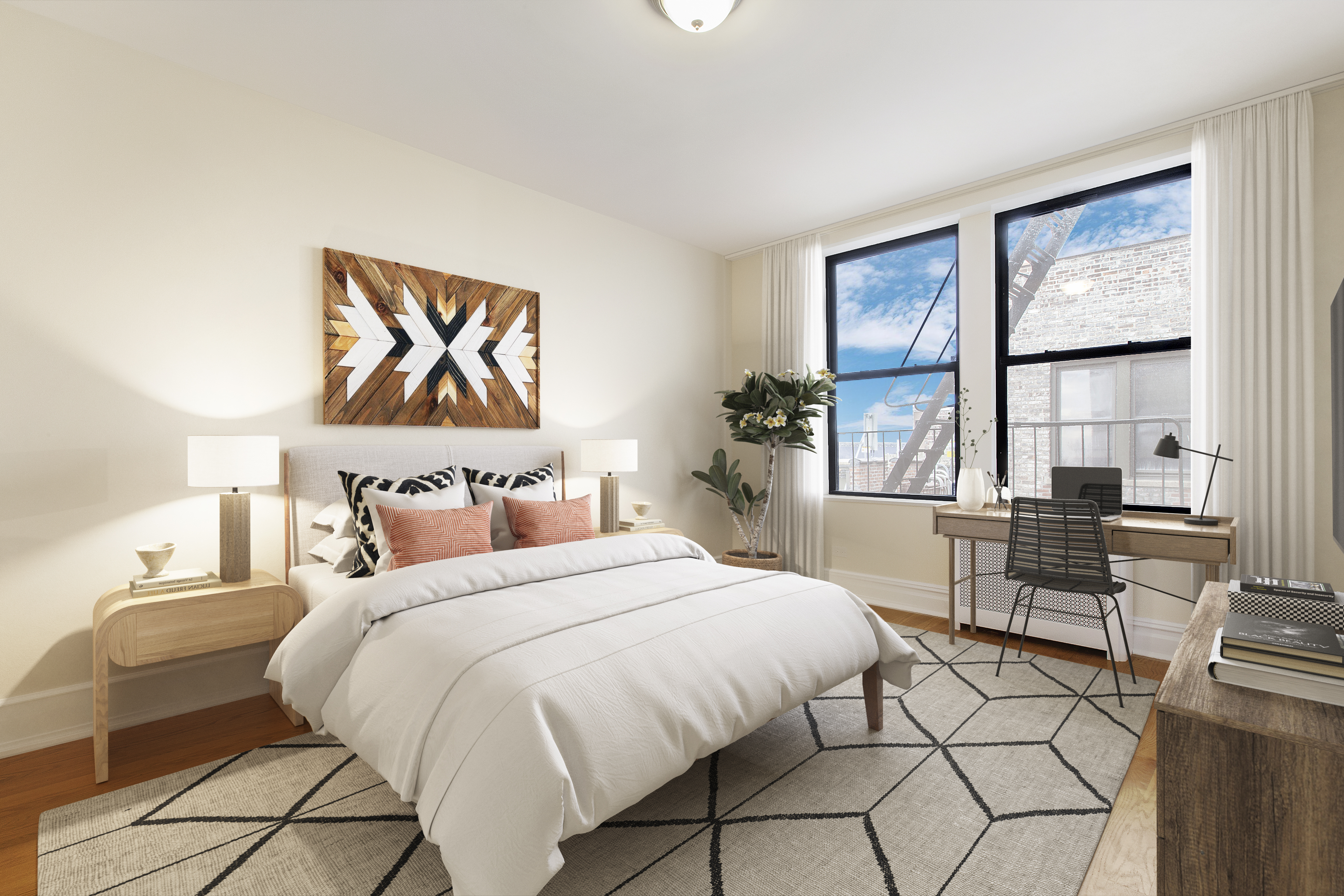 750 Riverside Drive, Unit 6B Manhattan, NY 10031 - Photo 4 of 9 a bedroom with a bed and a table