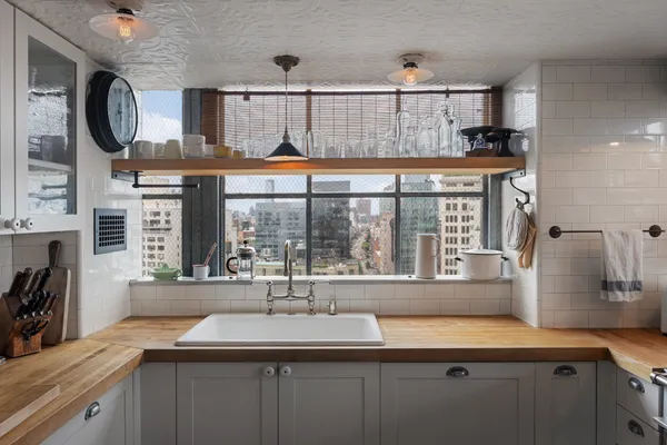 a kitchen with stainless steel appliances a sink and a stove