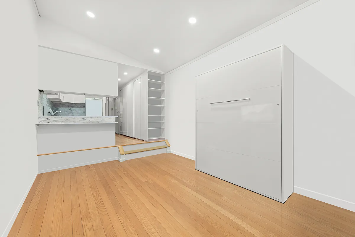 35 East 10th Street, Unit 2G Manhattan, NY 10003 - Photo 8 of 11 a view of an empty room with a kitchen
