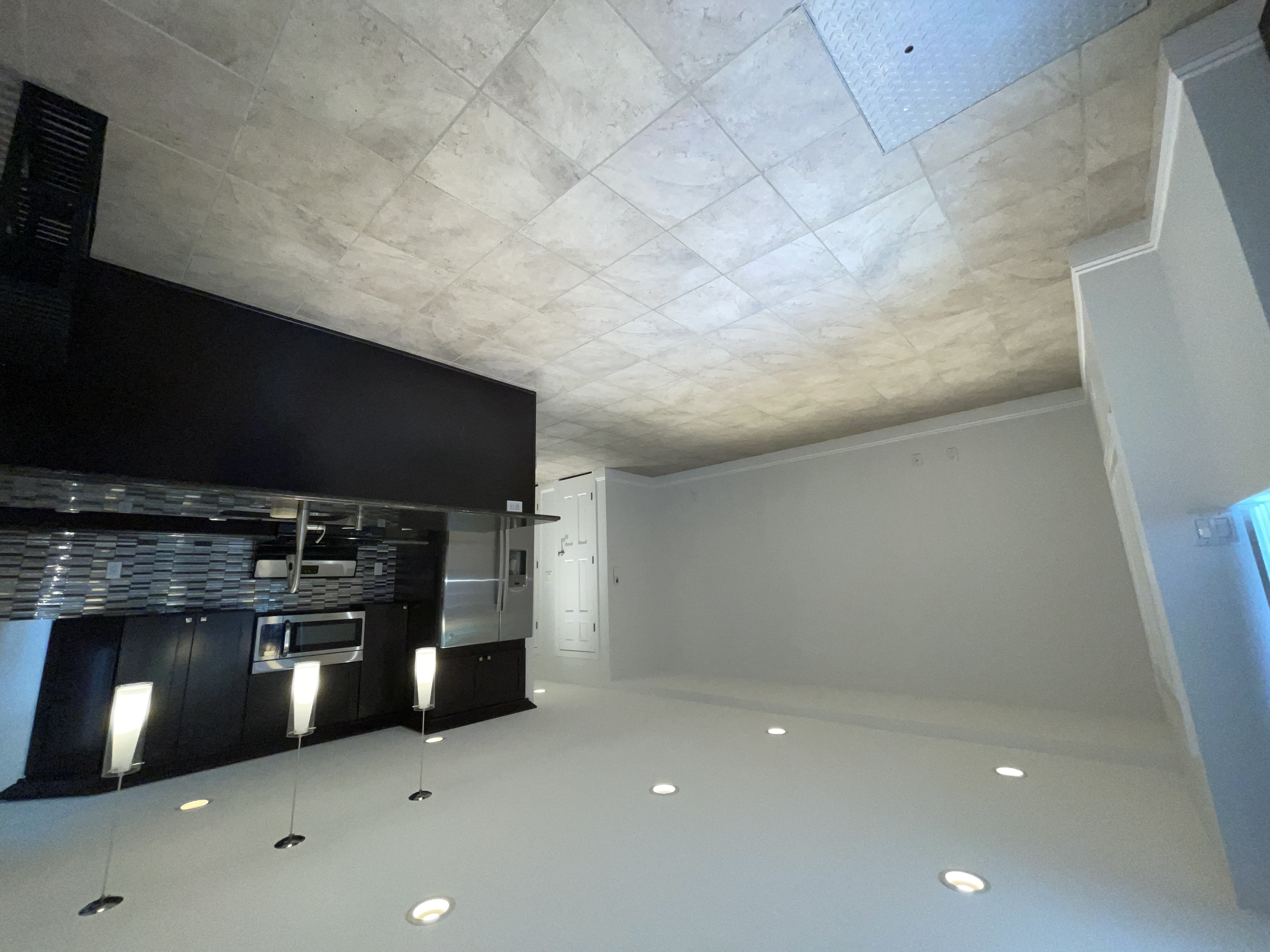 19-14 Astoria Park South, Unit 1B Queens, NY 11102 - Photo 4 of 11 a large kitchen with stainless steel appliances granite countertop a large counter top and a stove