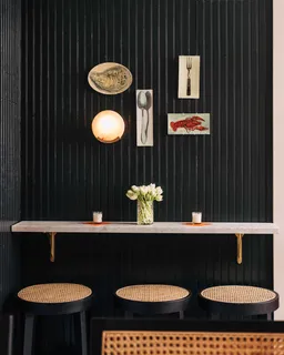 a bathroom with a sink toilet and mirror