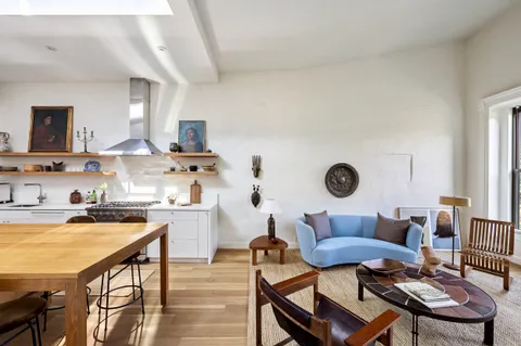 a view of kitchen with cabinets and wooden floor