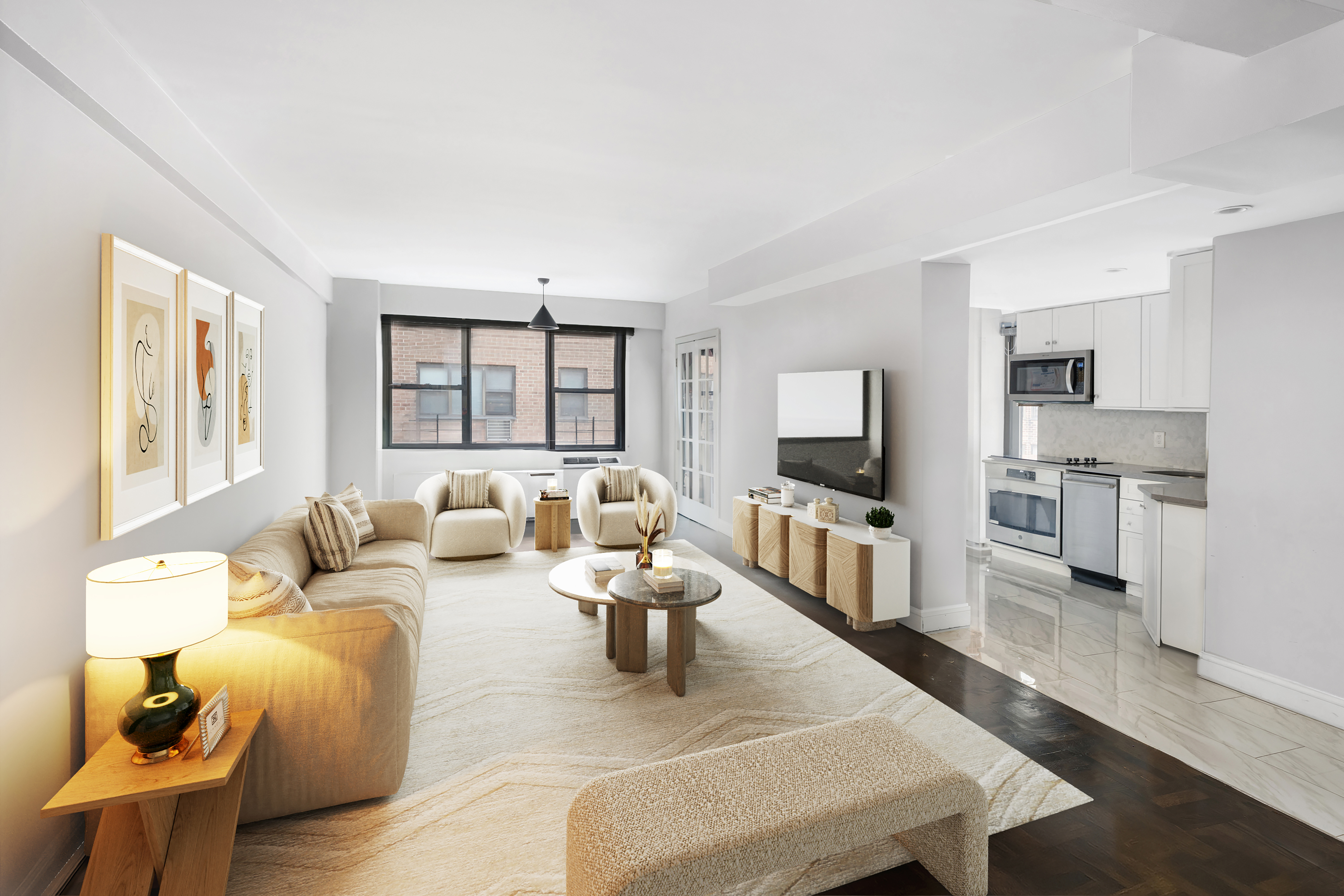 2 Tudor City Place, Unit 11KN Manhattan, NY 10017 - Photo 1 of 14 a living room with furniture and a flat screen tv
