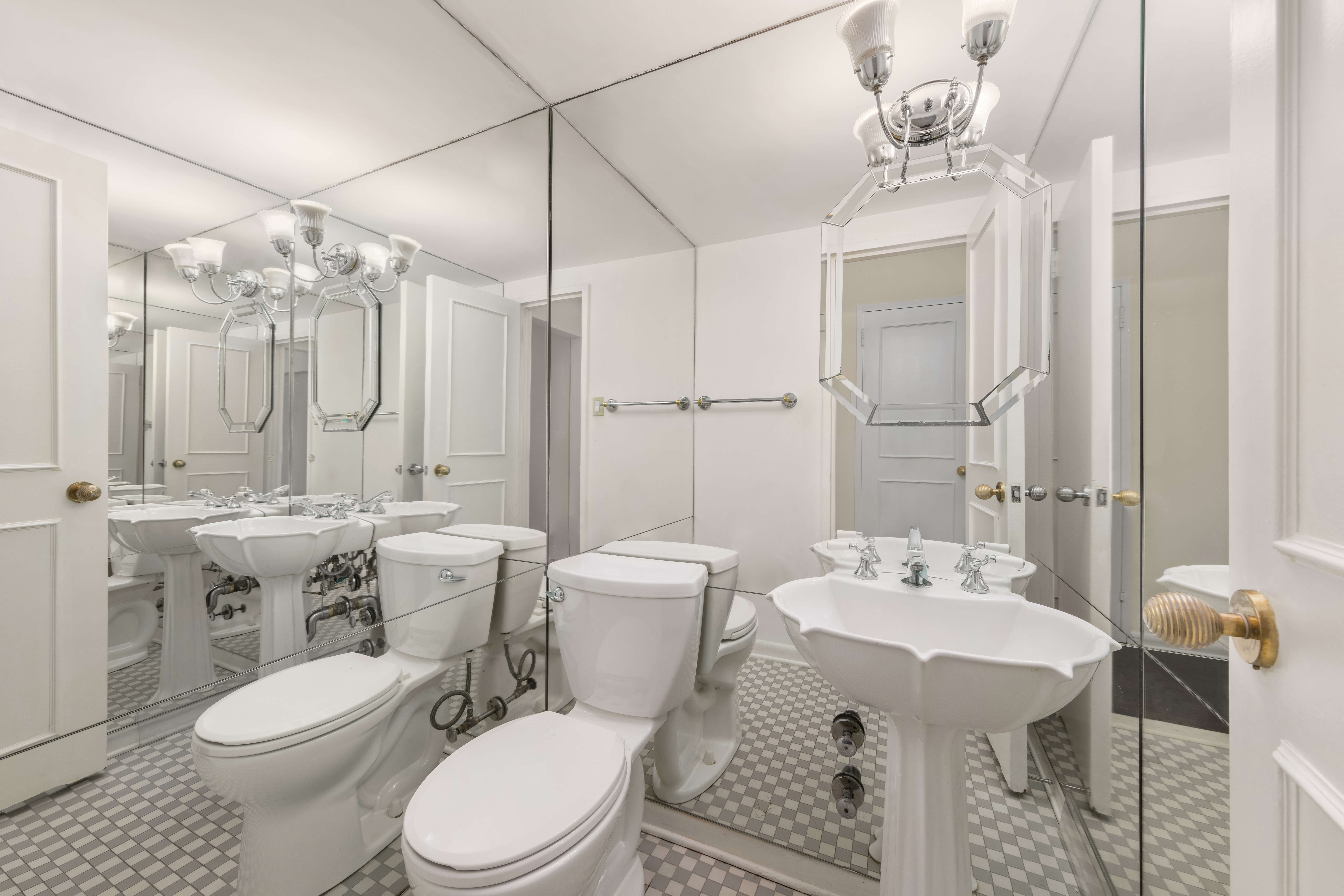 25 Sutton Place South, Unit 18L Manhattan, NY 10022 - Photo 8 of 11 a bathroom with a sink toilet and shower