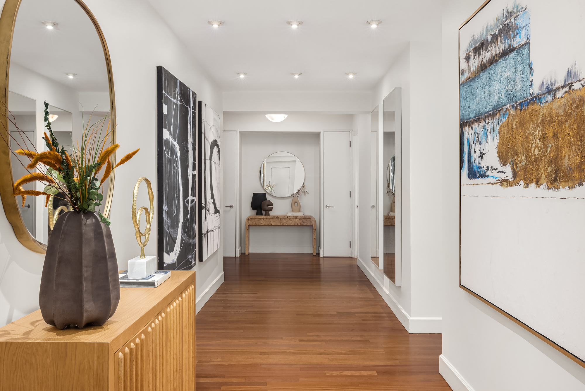 43 West 64th Street, Unit 7A Manhattan, NY 10023 - Photo 10 of 20 a hallway with wooden floor and windows