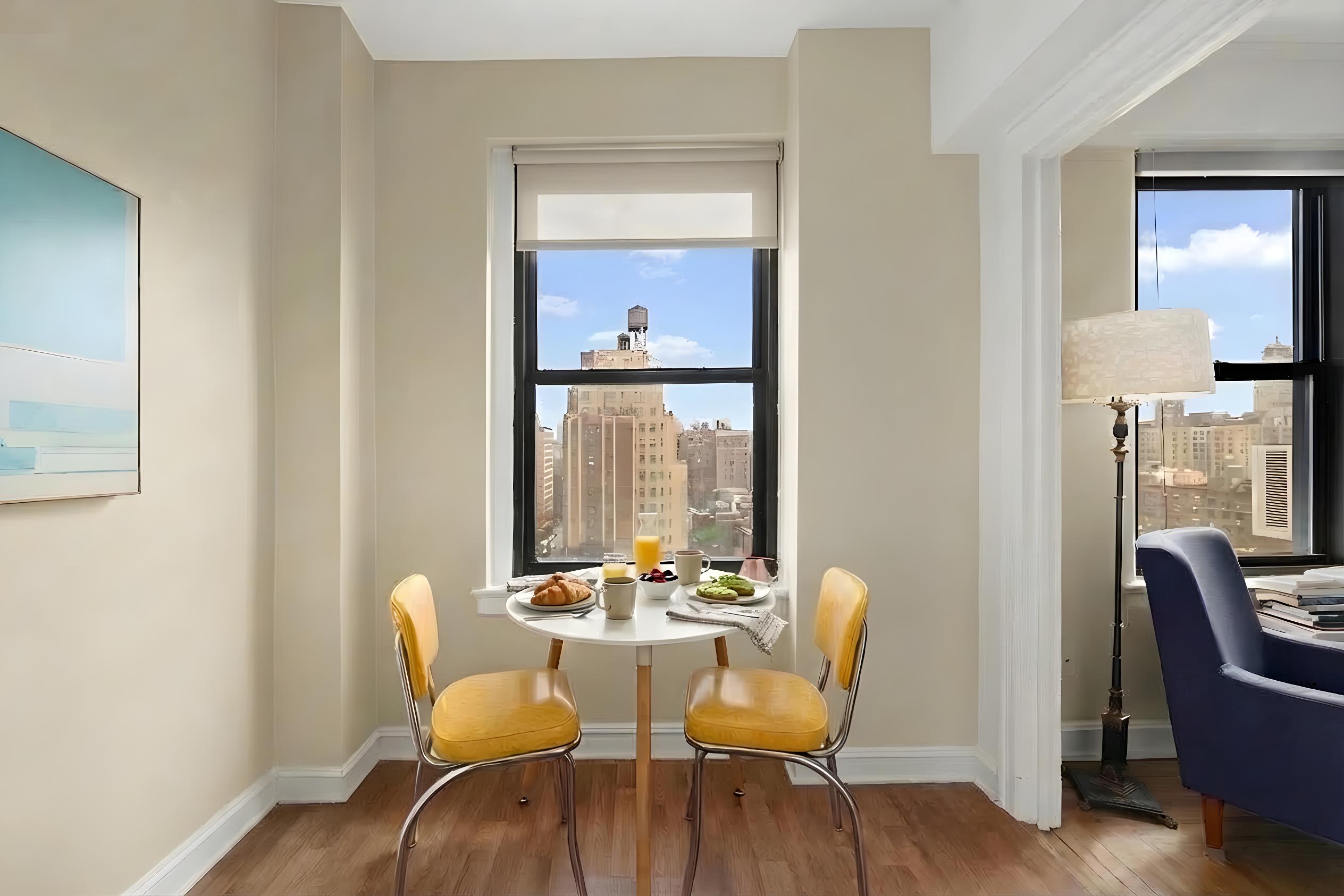110 West 86th Street, Unit 16C Manhattan, NY 10024 - Photo 3 of 12 a view of a dining room with furniture window and wooden floor