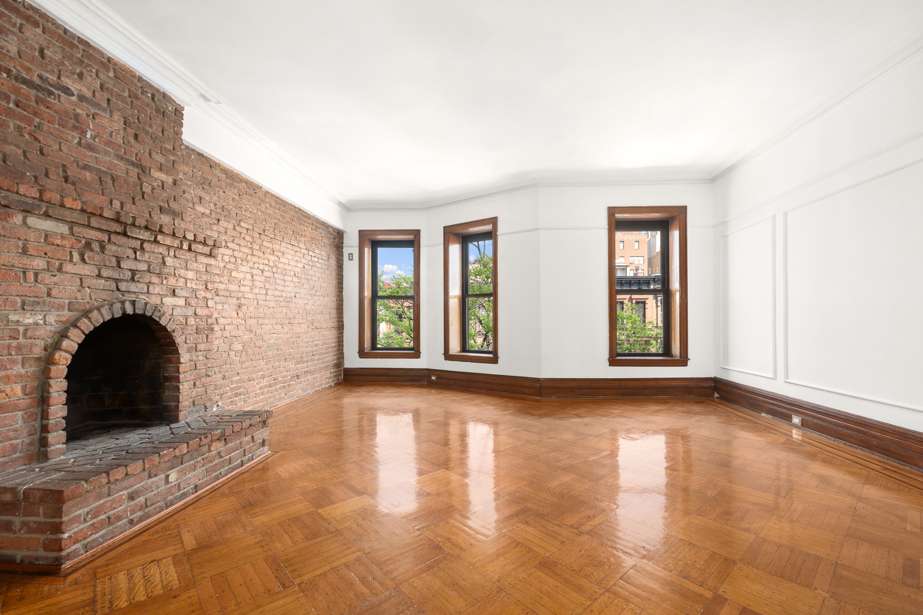 420 8th Street Brooklyn, NY 11215 - Photo 6 of 20 a view of empty room with fireplace and wooden floor