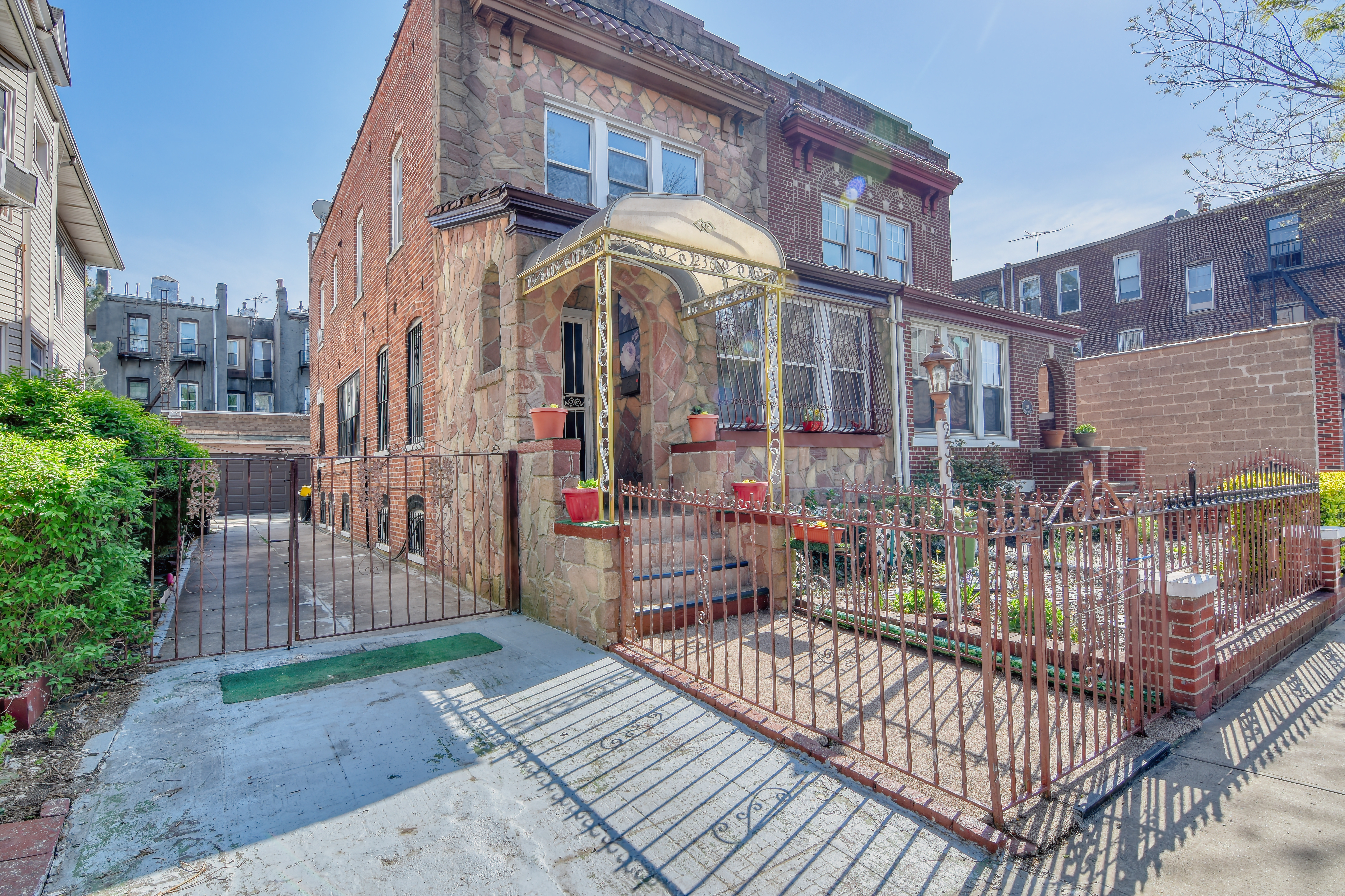 a view of a brick building with a porch
