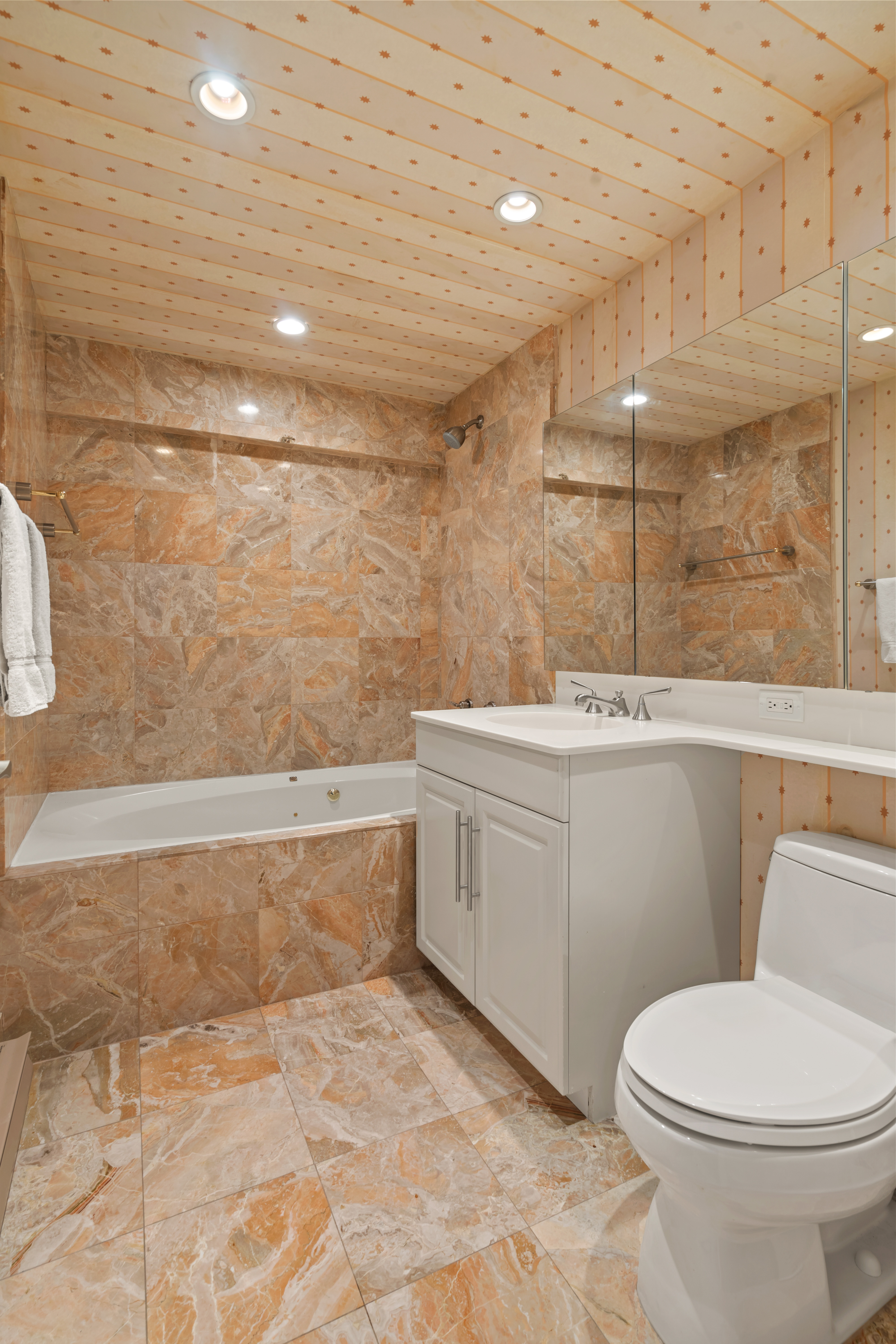 2521 Palisade Avenue, Unit 10A Bronx, NY 10463 - Photo 7 of 17 a bathroom with a sink a toilet and bathtub