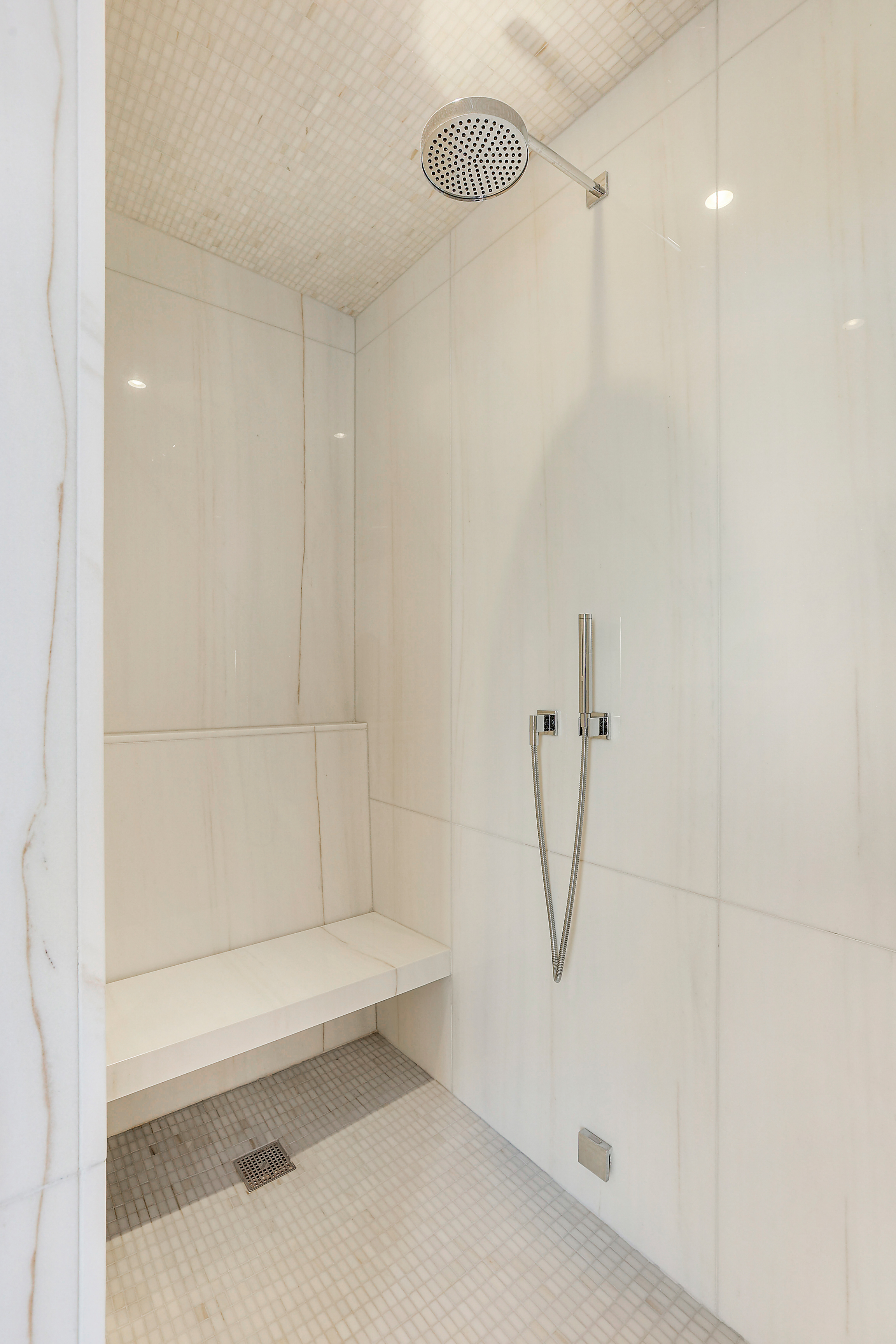 157 West 57th Street, Unit 51A Manhattan, NY 10019 - Photo 13 of 15 a bathroom with a shower and a shower
