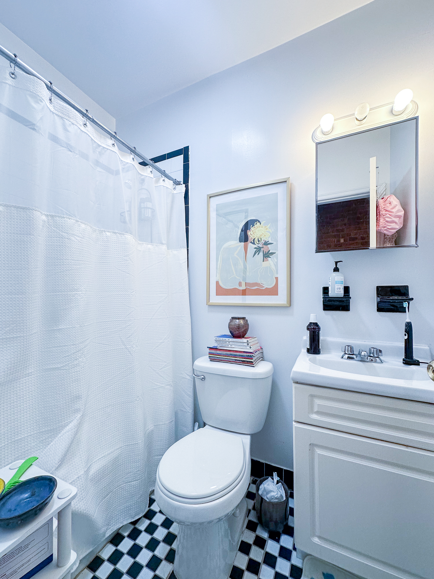 215 East 5th Street, Unit 7 Manhattan, NY 10003 - Photo 7 of 15 a bathroom with a toilet a sink and a mirror