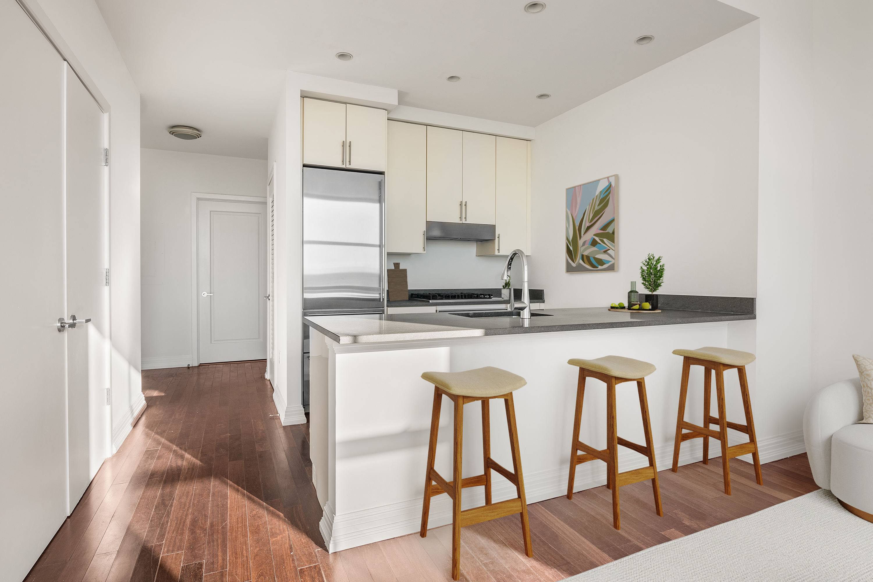 1 Hanson Place, Unit 16F Brooklyn, NY 11243 - Photo 2 of 15 a kitchen with a table chairs stove and cabinets