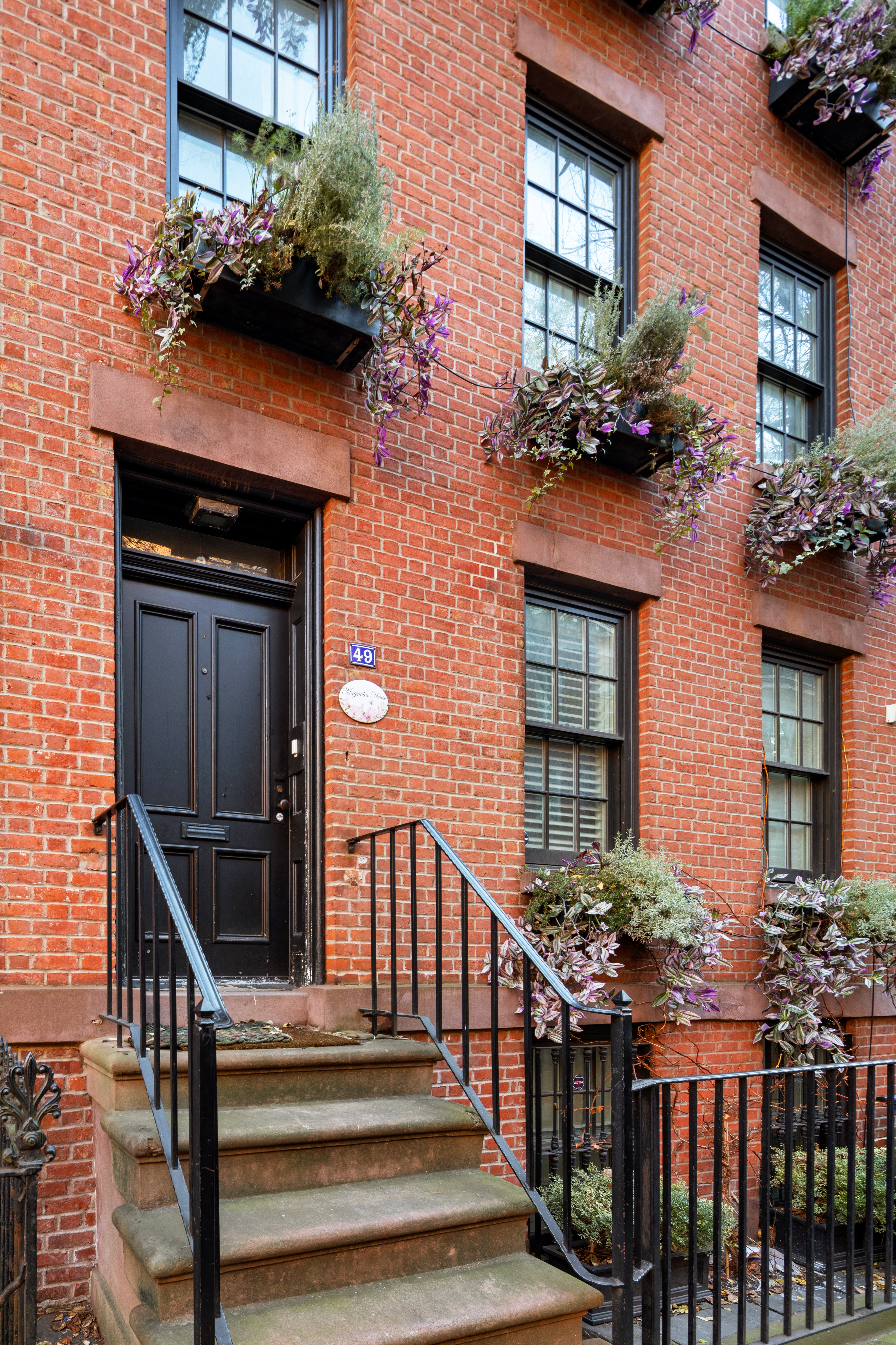 49 Barrow Street Manhattan, NY 10014 - Photo 24 of 25 a front view of a house having yard