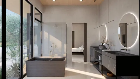 a en suite bathroom with a double vanity sink a mirror and a large mirror