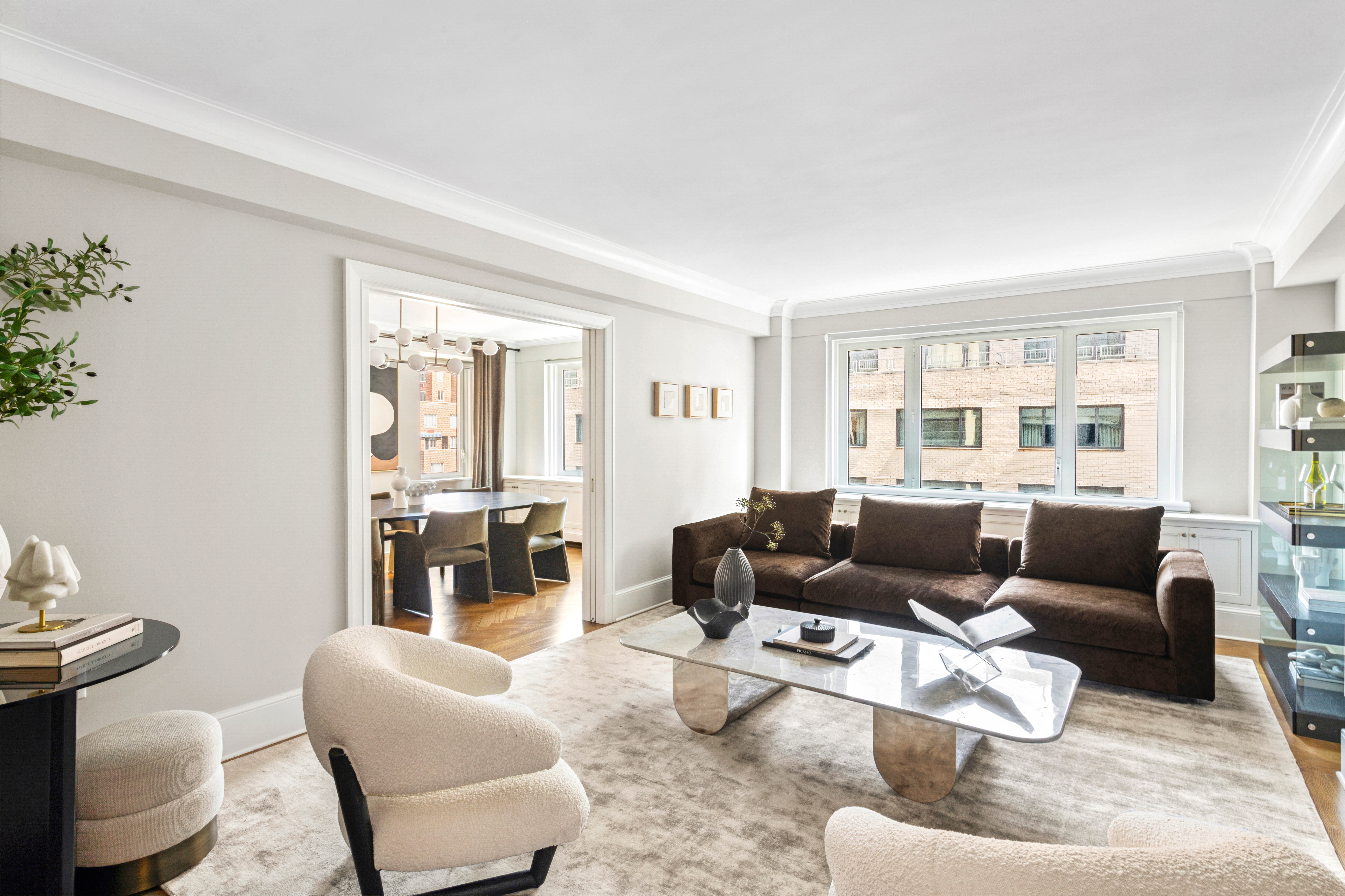 530 Park Avenue, Unit 12F Manhattan, NY 10065 - Photo 2 of 26 a living room with furniture and a window