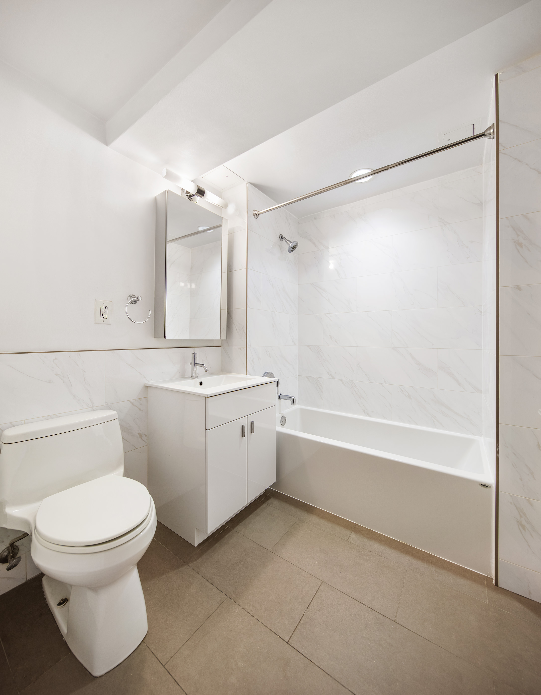171 West 131st Street, Unit 519 Manhattan, NY 10027 - Photo 5 of 10 a bathroom with a sink a toilet and a bathtub