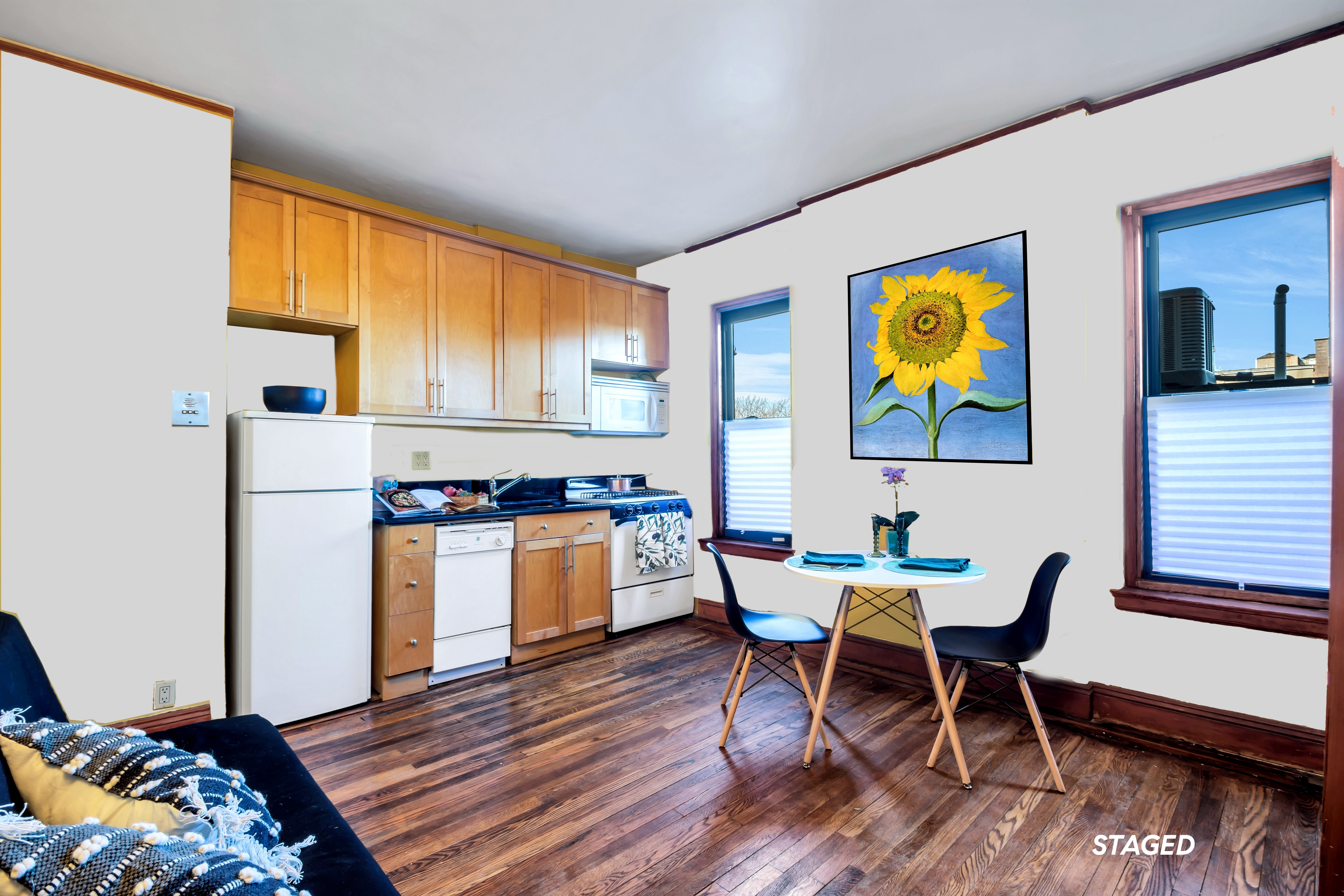 a workspace with furniture and painting on the wall