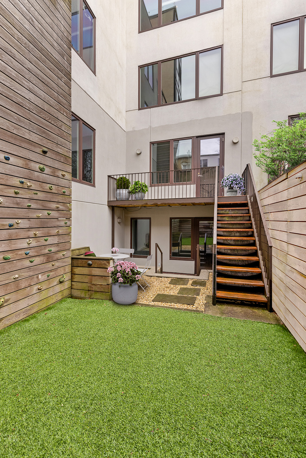 115 3rd Street, Unit 1 Brooklyn, NY 11231 - Photo 12 of 13 a view of a yard with brick wall and a fire pit