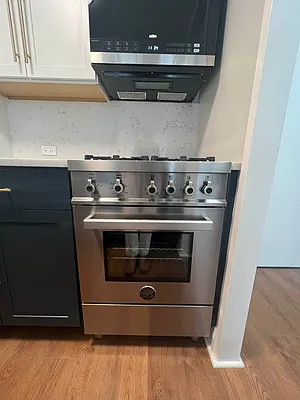 250 West 90th Street, Unit 6I Manhattan, NY 10024 - Photo 10 of 15 a stove top oven sitting inside of a kitchen