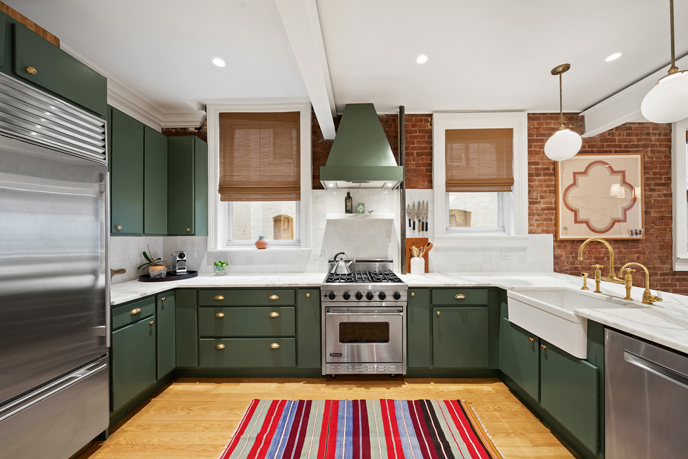 67 Perry Street, Unit 3 Manhattan, NY 10014 - Photo 12 of 22 a kitchen with a sink stove and cabinets